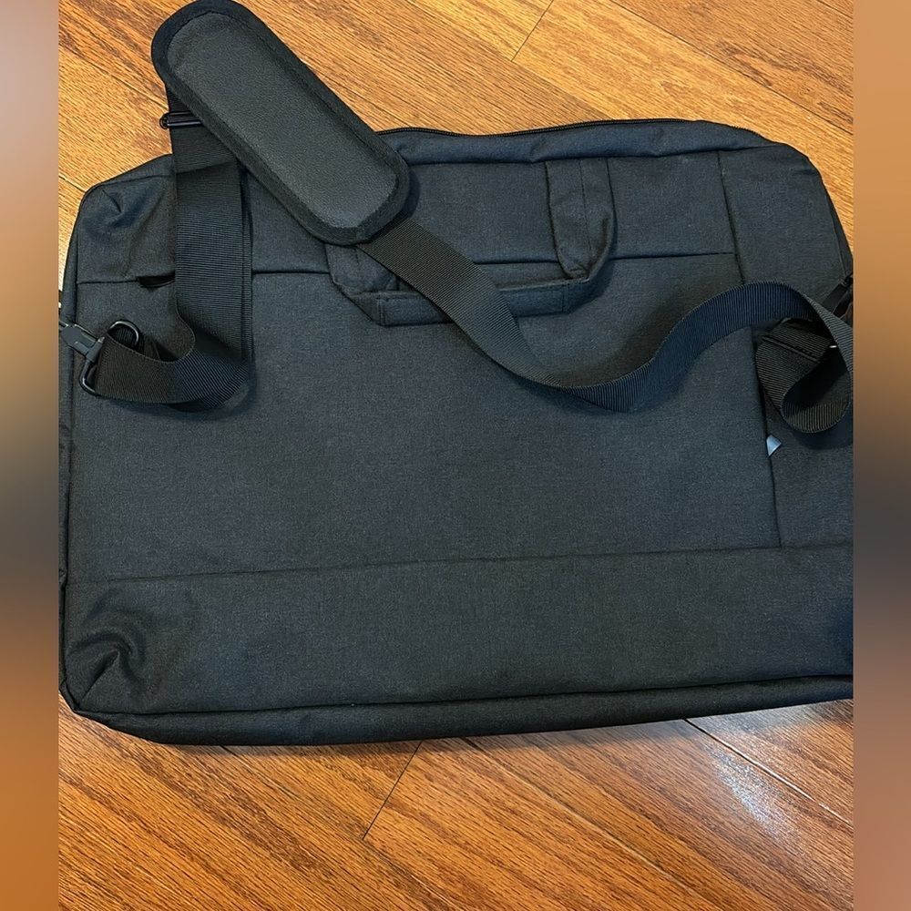 Black briefcase/padded 17.5" laptop sleeve. Use w/handle or 50" shoulder strap